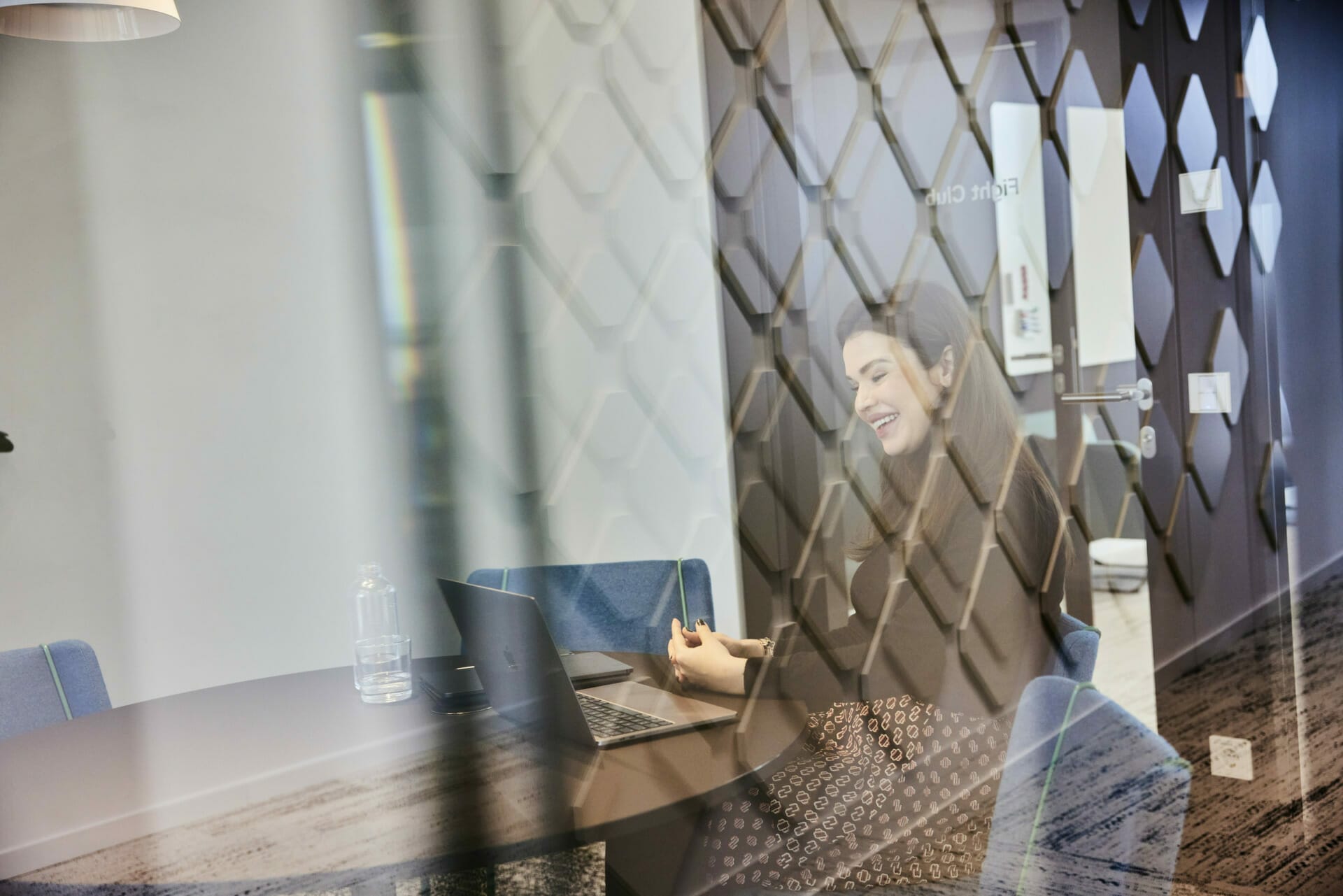 Woman at a Spryker office meeting room