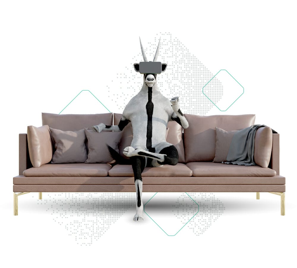 An anthropomorphic goat, fully immersed in a VR headset and gripping a controller, sits on a modern sofa adorned with pillows and a blanket, epitomizing the mantra: Stay Competitive With Visual Commerce.