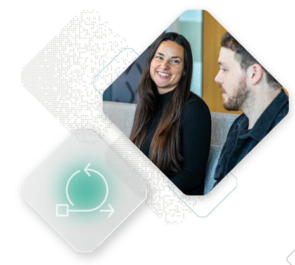 Two people sitting and talking in an office. One person, wearing black, is smiling while the other listens attentively. Geometric shapes and digital design elements are overlaid on the image, embodying a sense of digital transformation.