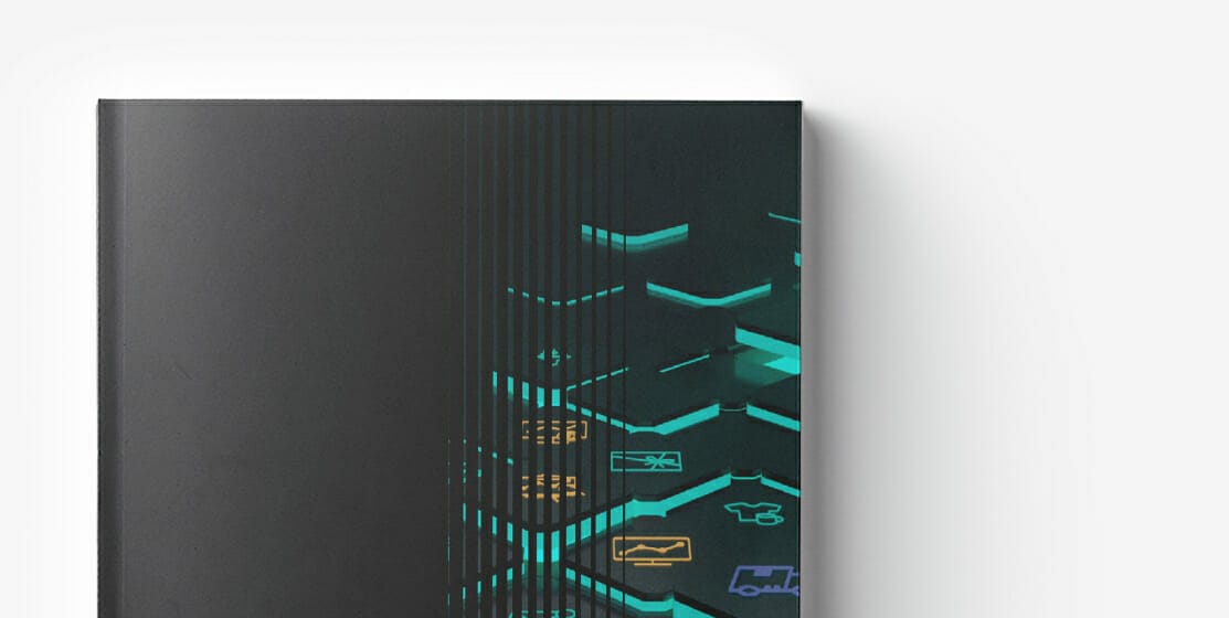 A black hardcover book with glowing geometric hexagons and various icons on the cover, including a truck, helicopter, and building. The hexagons and icons are illuminated in green and yellow, symbolizing the modern challenges of recruiting developers.
