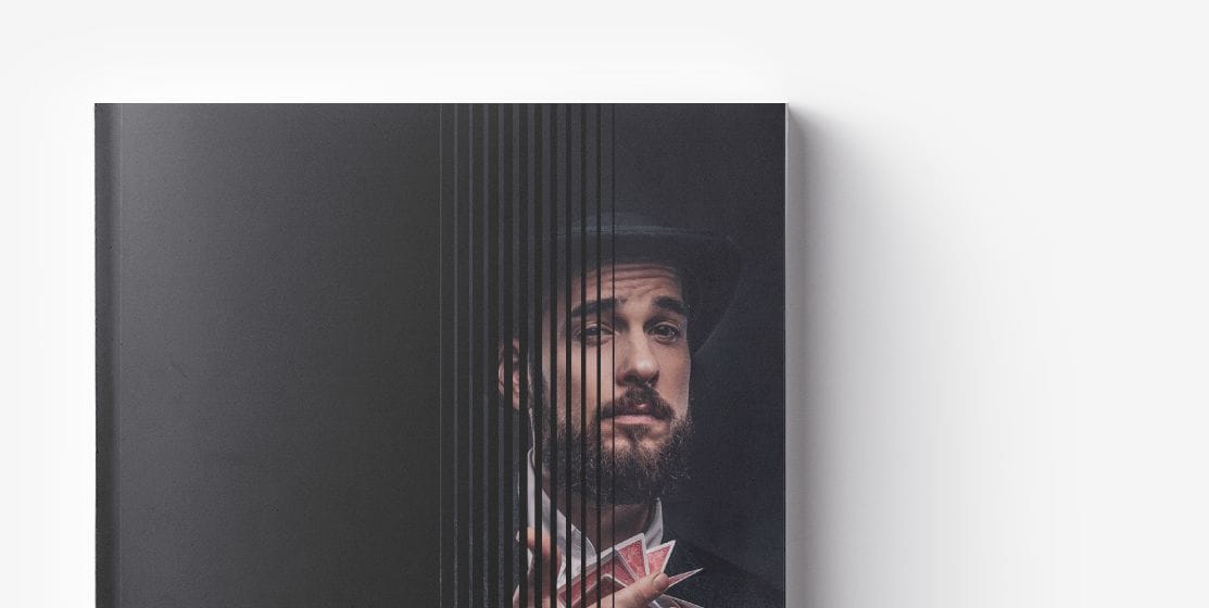 Front cover of a book with a partial image of a man wearing a hat and holding playing cards, obscured by vertical black lines on the left side, revealing secrets to Increase Bottom Line through innovative Retail E-commerce Strategies.