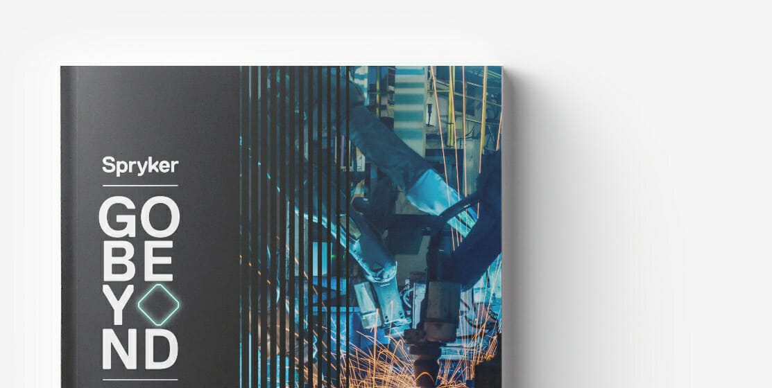 Cover of a book titled "Spryker GO BEYOND" with an abstract design featuring blue and green hues, geometric shapes, and a subtle nod to B2B marketplace dynamics.