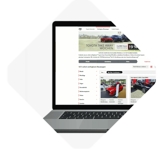 A laptop displaying a car dealership website showcases the benefits of online commerce, featuring images and listings of various vehicles for sale.